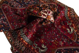 Surface texture of 2000s Shiraz rug with natural Wool and intricate pattern