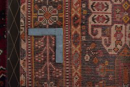 Backside of handmade 2000s Shiraz rug showing knot structure and weave density