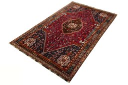 Corner detail of 2000s Shiraz rug showing border pattern and Wool pile