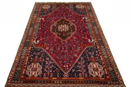 Surface texture of 2000s Shiraz rug with natural Wool and intricate pattern