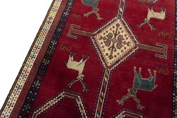 Backside of handmade 2000s Shiraz rug showing knot structure and weave density