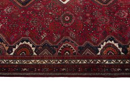 Corner detail of 2000s Shiraz rug showing border pattern and Wool pile