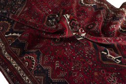 Surface texture of 2000s Shiraz rug with natural Wool and intricate pattern