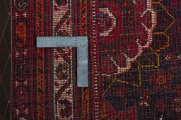 Backside of handmade 2000s Shiraz rug showing knot structure and weave density
