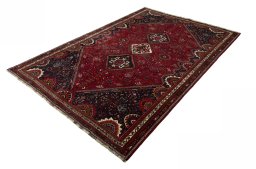 Corner detail of 2000s Shiraz rug showing border pattern and Wool pile