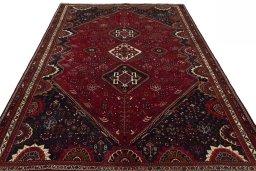 Surface texture of 2000s Shiraz rug with natural Wool and intricate pattern