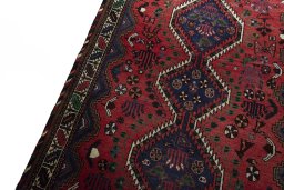 Backside of handmade 2000s Shiraz rug showing knot structure and weave density