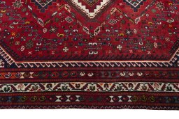 Corner detail of 2000s Shiraz rug showing border pattern and Wool pile