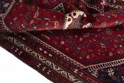 Surface texture of 2000s Shiraz rug with natural Wool and intricate pattern