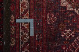 Backside of handmade 2000s Shiraz rug showing knot structure and weave density