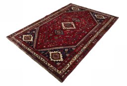 Corner detail of 2000s Shiraz rug showing border pattern and Wool pile