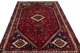 Surface texture of 2000s Shiraz rug with natural Wool and intricate pattern