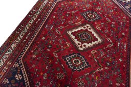 Backside of handmade 2000s Shiraz rug showing knot structure and weave density