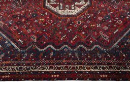 Corner detail of 1970s Shiraz rug showing border pattern and Wool pile