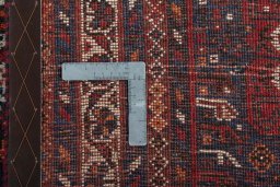 Backside of handmade 1970s Shiraz rug showing knot structure and weave density