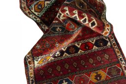 Corner detail of 2000s Shiraz rug showing border pattern and Wool pile