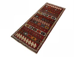 Corner detail of 2000s Shiraz rug showing border pattern and Wool pile