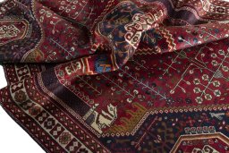 Surface texture of 2000s Shiraz rug with natural Wool and intricate pattern