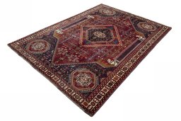 Corner detail of 2000s Shiraz rug showing border pattern and Wool pile