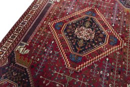 Backside of handmade 2000s Shiraz rug showing knot structure and weave density
