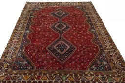 Surface texture of 2000s Shiraz rug with natural Wool and intricate pattern