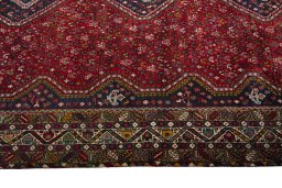 Full view of 2000s Shiraz rug from Iran / Persia, 290 × 205 cm in Red tones