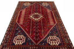Surface texture of 2000s Shiraz rug with natural Wool and intricate pattern