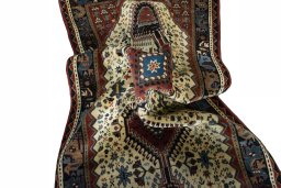 Corner detail of 2000s Shiraz rug showing border pattern and Wool pile