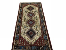 Surface texture of 2000s Shiraz rug with natural Wool and intricate pattern