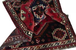 Corner detail of 2000s Shiraz rug showing border pattern and Wool pile