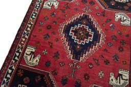 Surface texture of 2000s Shiraz rug with natural Wool and intricate pattern