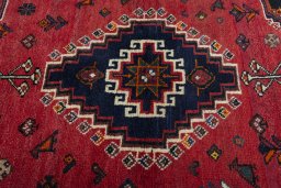 Backside of handmade 2000s Shiraz rug showing knot structure and weave density