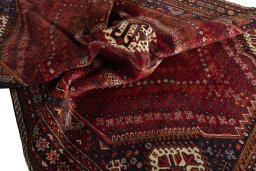 Surface texture of 2000s Shiraz rug with natural Wool and intricate pattern