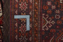 Backside of handmade 2000s Shiraz rug showing knot structure and weave density