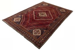 Corner detail of 2000s Shiraz rug showing border pattern and Wool pile