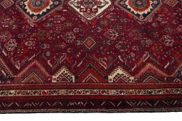 Corner detail of 2000s Shiraz rug showing border pattern and Wool pile