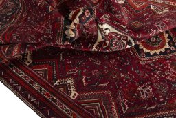 Surface texture of 2000s Shiraz rug with natural Wool and intricate pattern