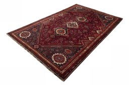 Corner detail of 2000s Shiraz rug showing border pattern and Wool pile