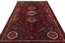 Surface texture of 2000s Shiraz rug with natural Wool and intricate pattern