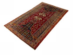 Corner detail of 2000s Shiraz rug showing border pattern and Wool pile