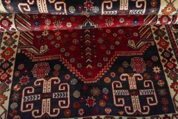 Corner detail of 2000s Shiraz rug showing border pattern and Wool pile