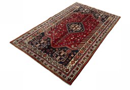 Corner detail of 2000s Shiraz rug showing border pattern and Wool pile