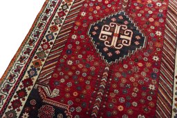 Backside of handmade 2000s Shiraz rug showing knot structure and weave density