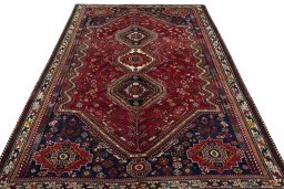 Surface texture of 2000s Shiraz rug with natural Wool and intricate pattern
