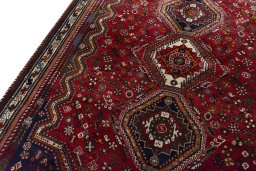 Backside of handmade 2000s Shiraz rug showing knot structure and weave density