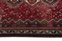 Full view of 2000s Shiraz rug from Iran / Persia, 287 × 185 cm in Red tones