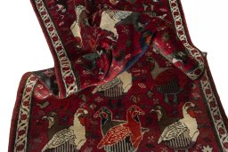 Corner detail of 2000s Shiraz rug showing border pattern and Wool pile