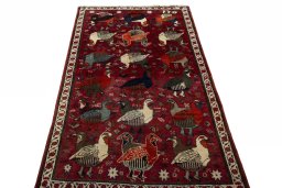 Surface texture of 2000s Shiraz rug with natural Wool and intricate pattern