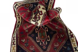 Corner detail of 2000s Shiraz rug showing border pattern and Wool pile