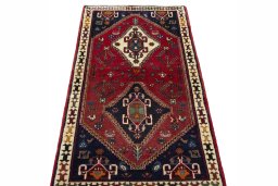 Surface texture of 2000s Shiraz rug with natural Wool and intricate pattern